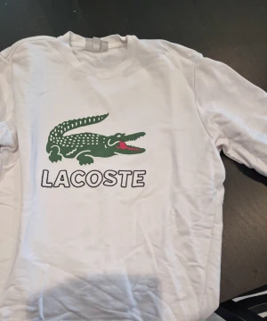 Lacoste - Lacoste sweatshit, bra skick storlek M.
