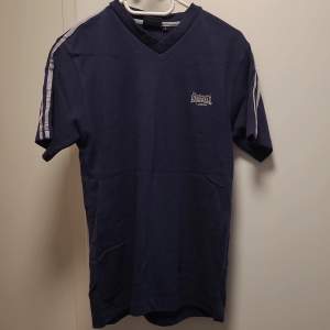 Size S well used in good condition dark blue t-shirt 