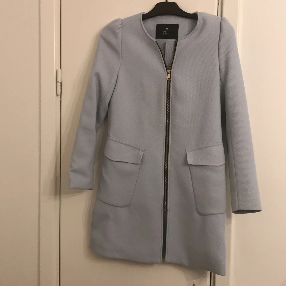 Ljusblå kappa strl 36