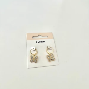 Fjärilsörhängen - Säljer dessa superfina guldiga örhängena, aldrig använda, frakt kostar 14 kr! 