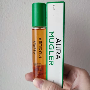 Aura Mugler Perfume - Aura Mugler Perfume. 33ml bottle. New! The box has some small tears great all year around fragrance.