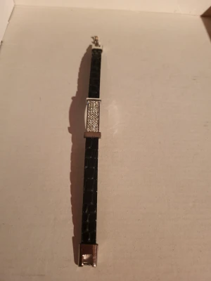 Y2k vintage bracelet - Perfect for the resurgence of y2k fashion this braclet will dazzle on your wrist. It is about 19cm in length. Has 2 small scuffs on the leather and 1 small scuff on the metal. Barely noticeable though! See last 2 pictures.