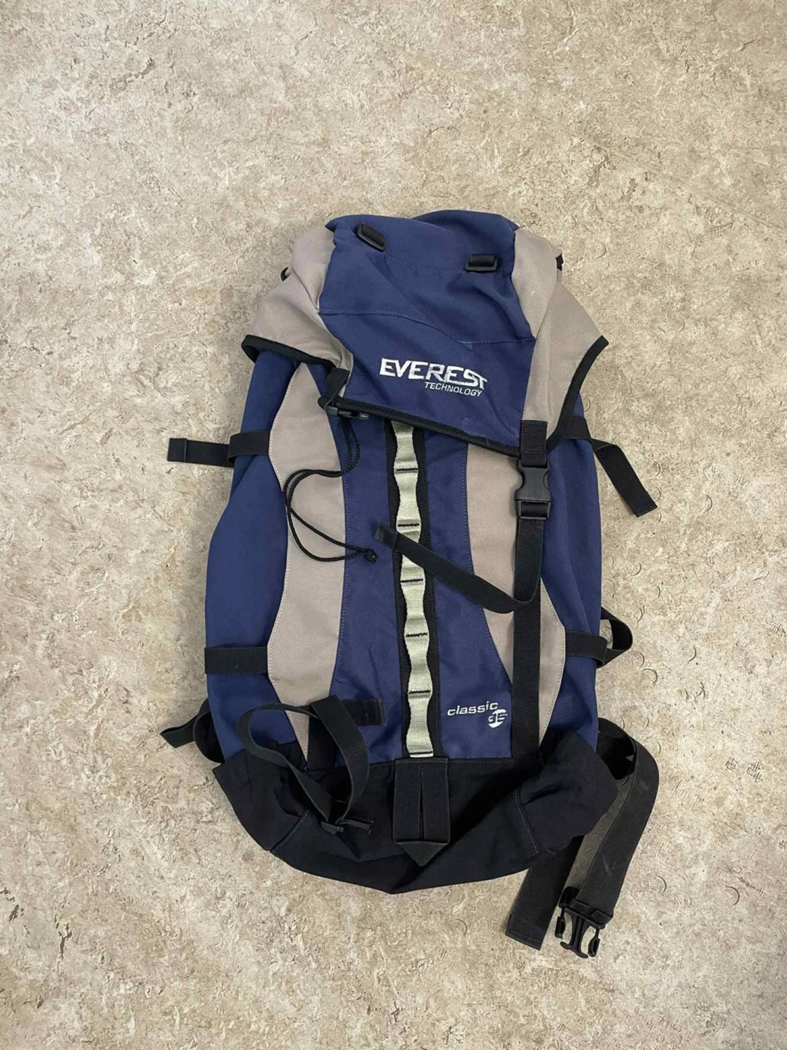Blå och grå Everest ryggsäck