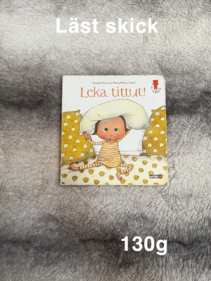 Bok ” leka tittut” - Läst skick. Skav på omslag. Har suttit en lapp på baksidan. Älskad och välläst.