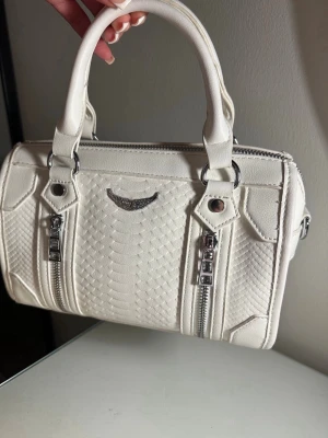 Zadig & Voltaire - White bag looks like a Zadig & Voltaire (so it's not real) Bought just a few months ago so only minor wear and dirt which I haven't tried to wash but doesn't show when used