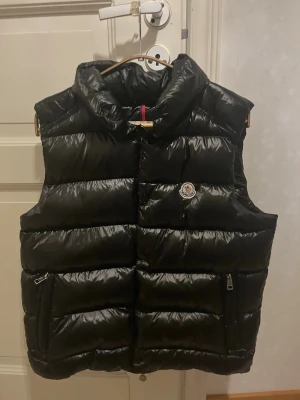 Moncler black vest - Authentic Moncler black down puffer vest in very good condition. Classic design with iconic logo patch. Warm, lightweight and perfect for layering.  Size 3 (fits S/M). Zipper pockets. Clean and well maintained. 