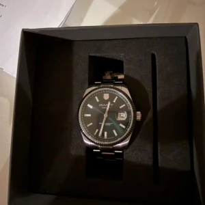 Klockan gant - Klockan gant helt ny med kvittor med kartong och allt 