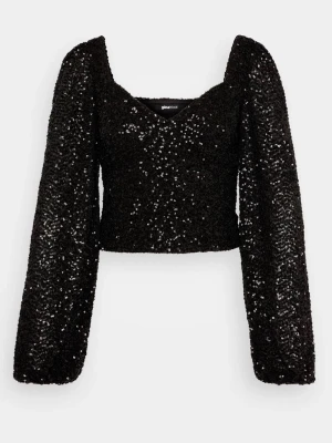 Svart paljettopp strl. M - Glittrig svart topp från Gina Tricot med paljetter över hela ytan. Modellen är croppad med långa puffiga ärmar och v-ringad halsringning. Perfekt till nyårsafton!