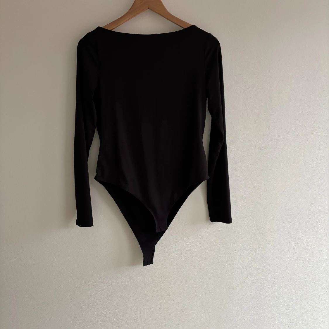 Svart långärmad bodysuit från H&M