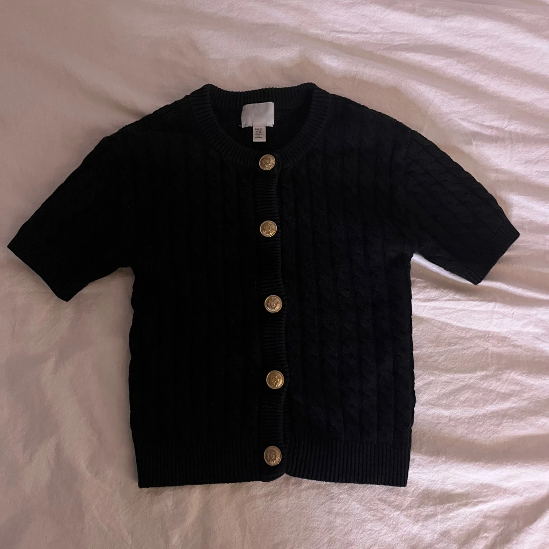 Svart kofta med guldknappar H&M