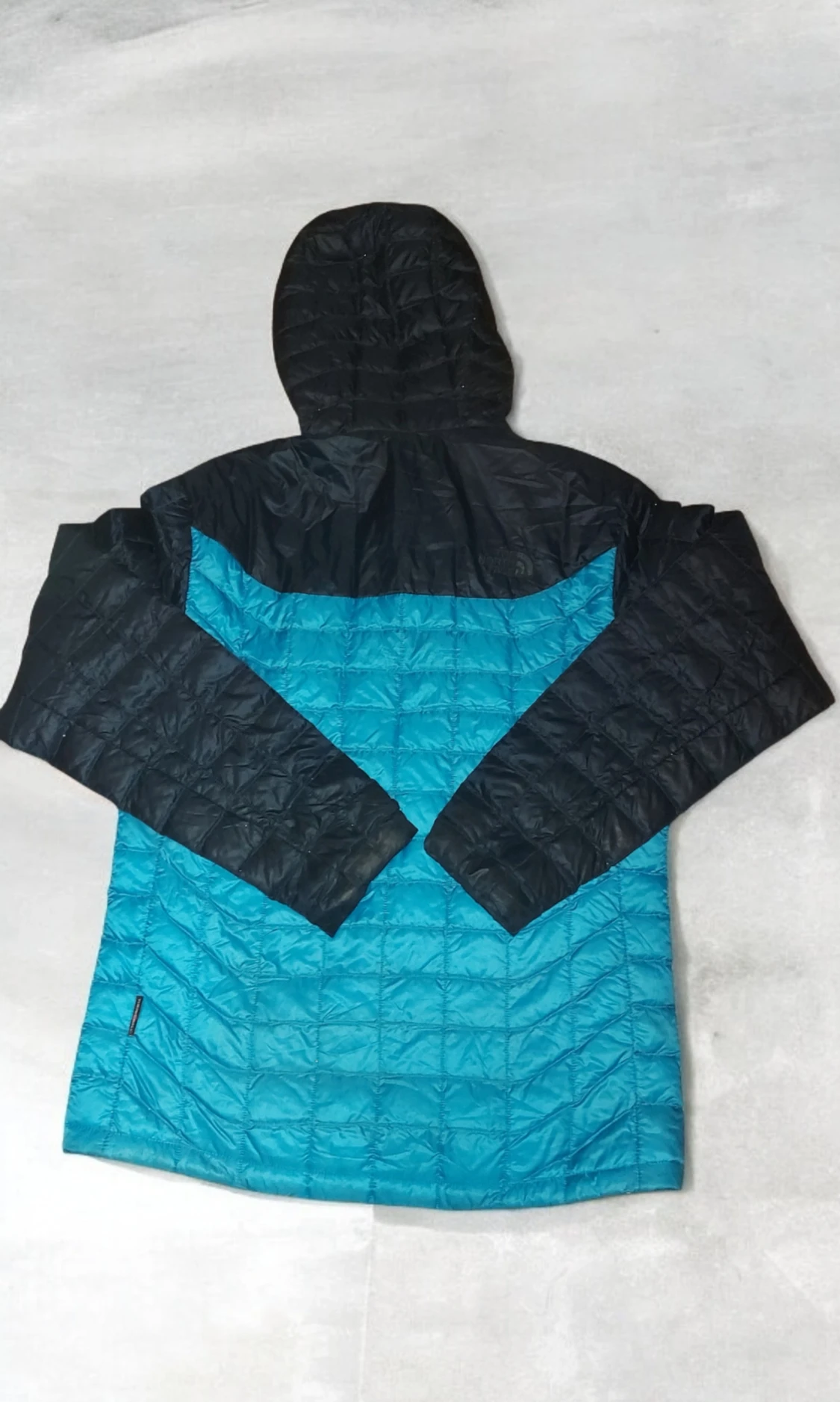 Blå och svart dunjacka från The North Face - 1