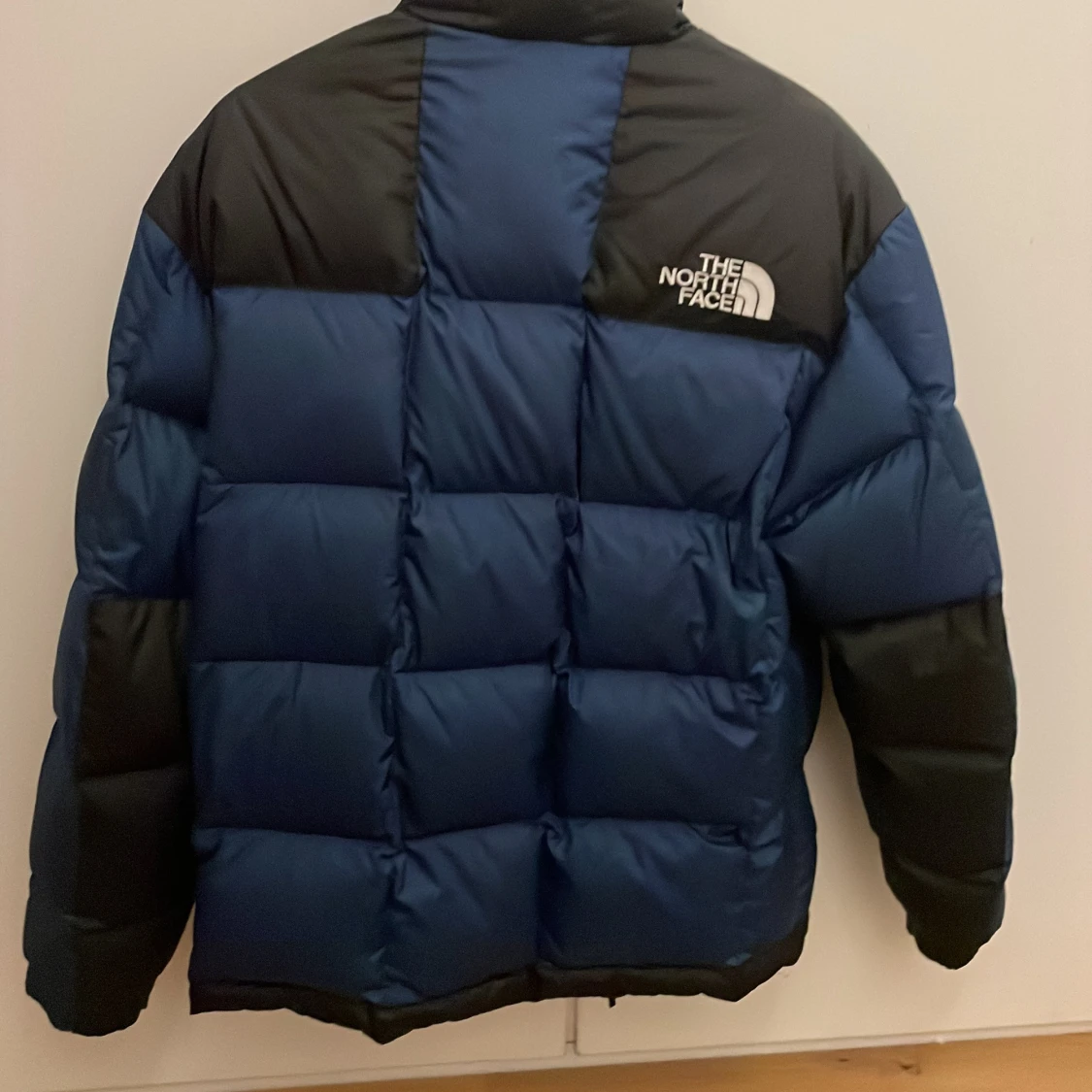 Blå och svart dunjacka The North Face - 1