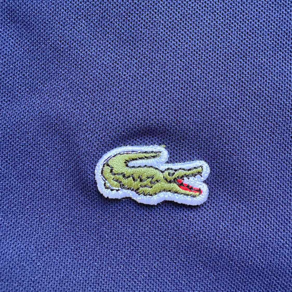 Mörkblå pikétröja från Lacoste - 1