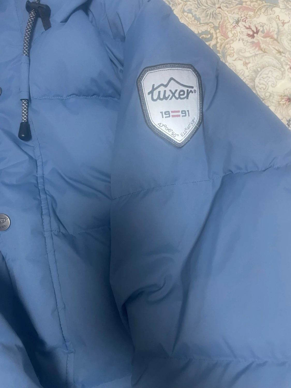 Blå dunjacka från Tuxer med huva - 1