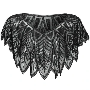 Svart glittrig bolerotopp med paljetter - Supersnygg svart bolerotopp med glittriga paljetter och transparent mesh. Toppens spetsiga kanter och v-ringning ger en cool och unik look. Perfekt att slänga över ett linne för att lyfta outfiten till nästa nivå. Aldrig använd. 