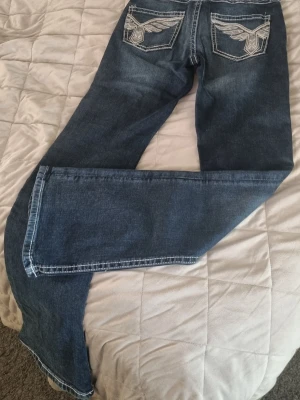 Jeans Gina young  - Låg midja, bootcut. Helt oanvända.