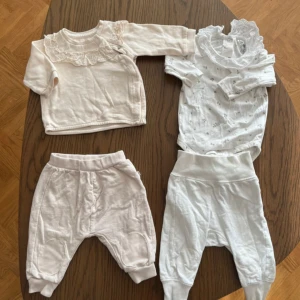 2 klädset bebis - Klädpaket i storlek 62. En tröja från H&M, en body från Iloveeco, ett par byxor från tiny one och ett par byxor från Newborn by Lindex, fint skick