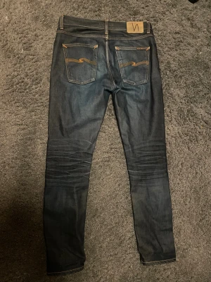 Nudie Nudie Jeans Solid Ollie Dry Japan Selvage - Inte så använda vilket man ser på Jeansen inga hål eller fläckar.    Org pris 2500
