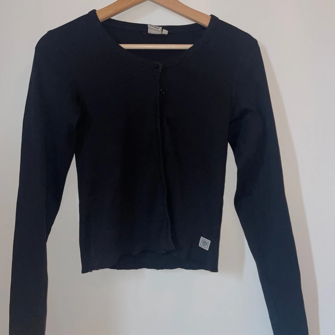 Svart kofta från SNRHIT