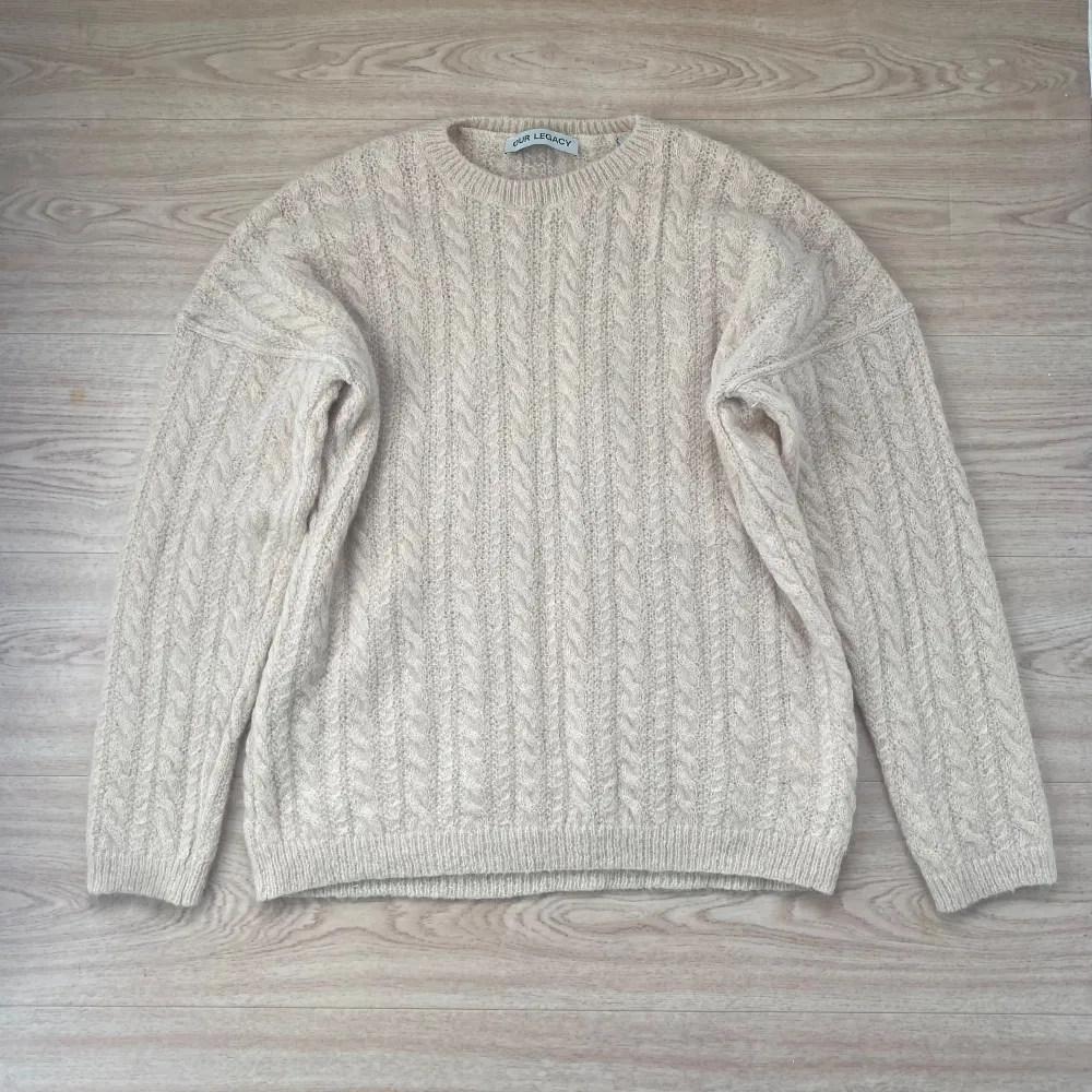 Amazing oversized soft wool and alpaca knit from Our Legacy. Italian yarn and a nice cream color. Completely sold out. The knit has been gently used and is still in excellent condition. Tagged 48, fits M-L. Boxy & wide. . Stickat.