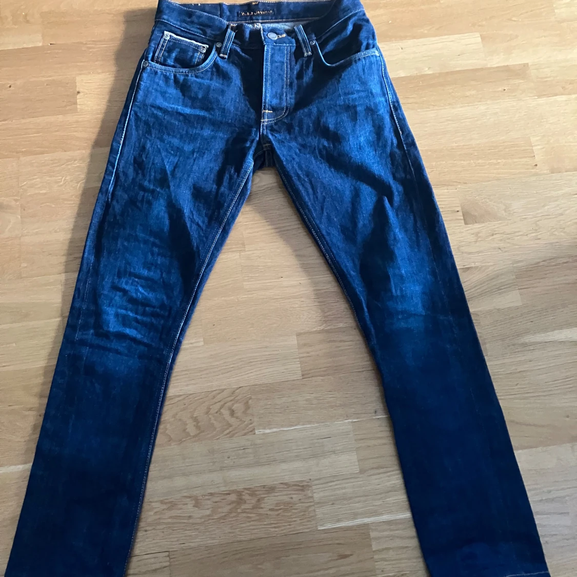 Mörkblå jeans från Nudie Jeans modell Grim Tim - OANVÄNDA
