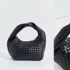 Svart flätad handväska - Snygg svart handväska, helt ny och aldrig använd. Från Gina tricot. Nypris 399kr