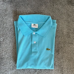 Lacoste Piké - En riktigt fin Lacoste piké i storlek M  