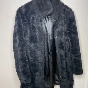 Fuskpäls  - Tillfredsställande kvalité 