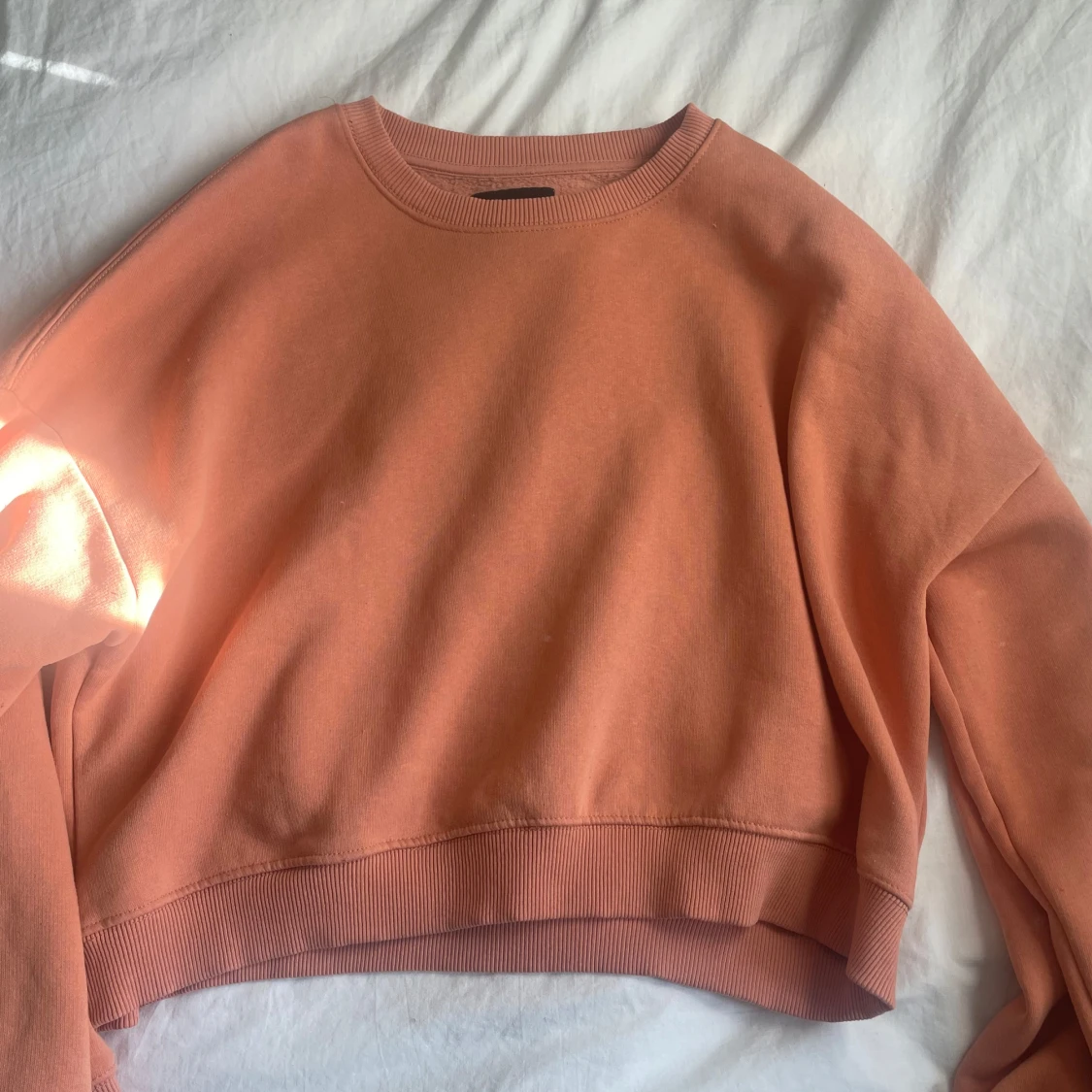 Persika färgad sweatshirt 