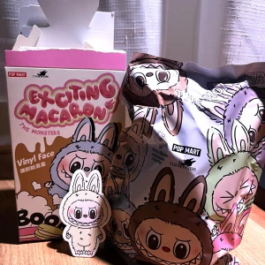Exciting Macaron The Monsters Labubu - Soymilk Labubu Macaron from Pop Mart. Brand new & unopened bag, still in original blind bag  packaging. The box has been opened (not the bag) to check for the secret figure.  Bought from Popmart’s official website & can show you the receipt If you want proof. 