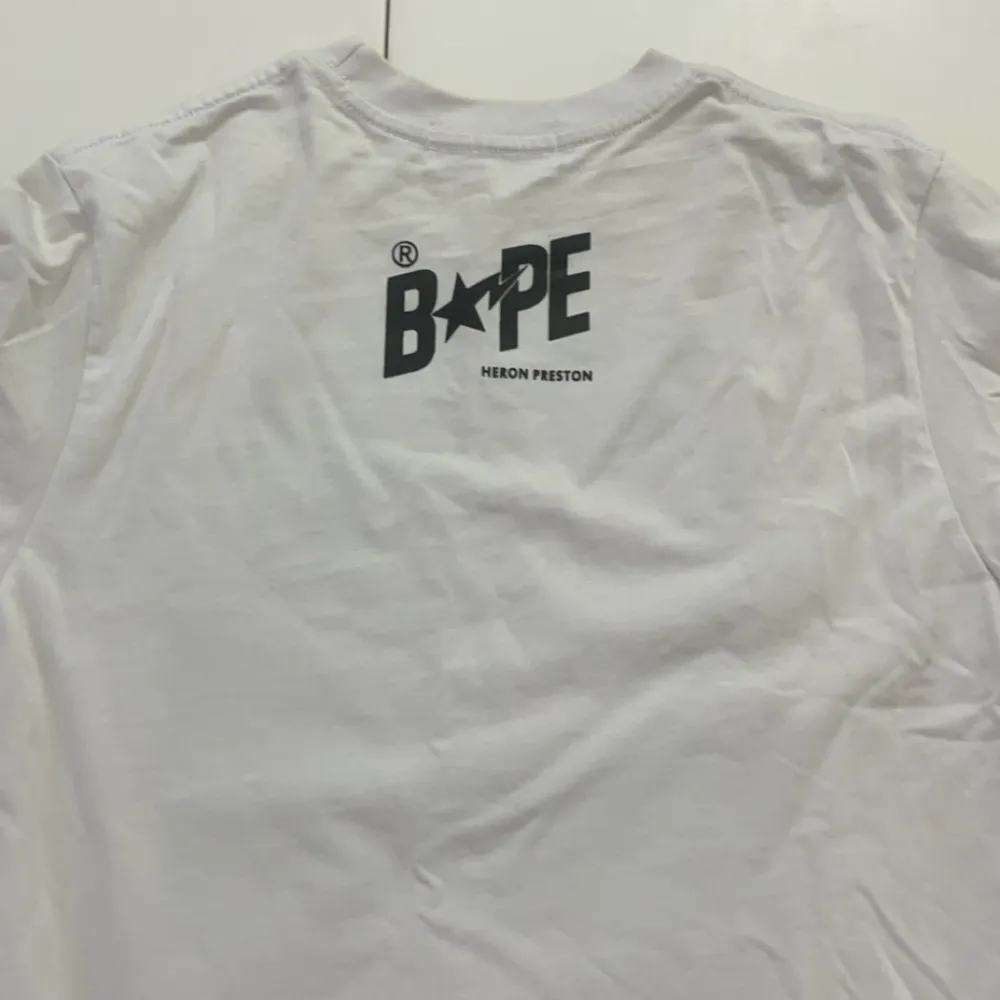 A Bathing Ape Heron Preston  Shirt  Brand new whit package, tag  Size:S-M. T-shirts.