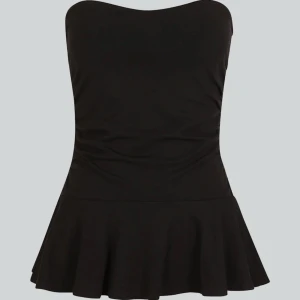 Utsvängd tubtop - Tub top som är kjol liknade/utsvängd där nere. Storlek M och stretchig.