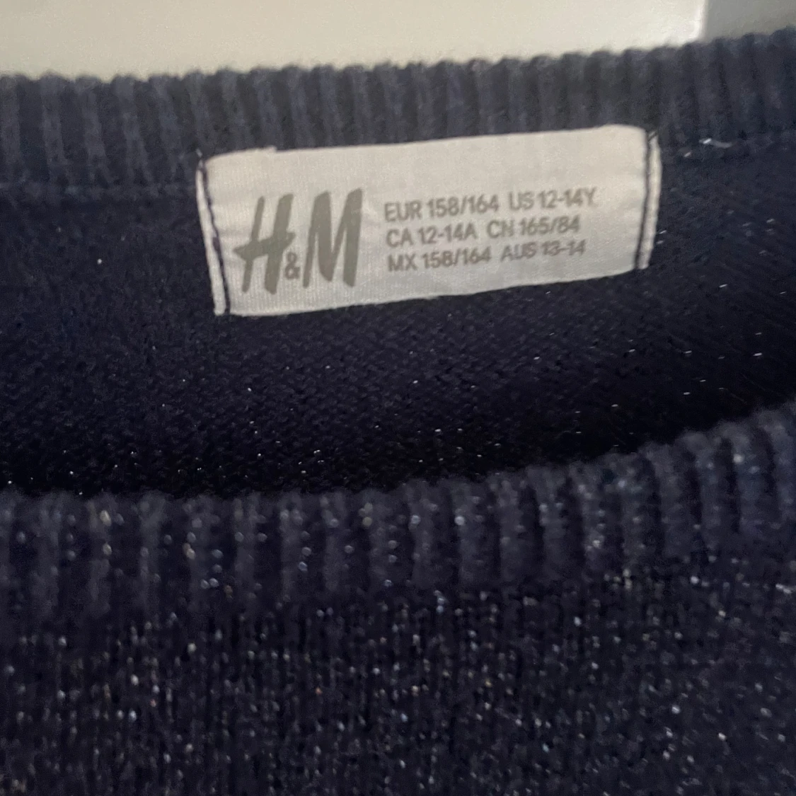 Glittrig långärmad blus - 90