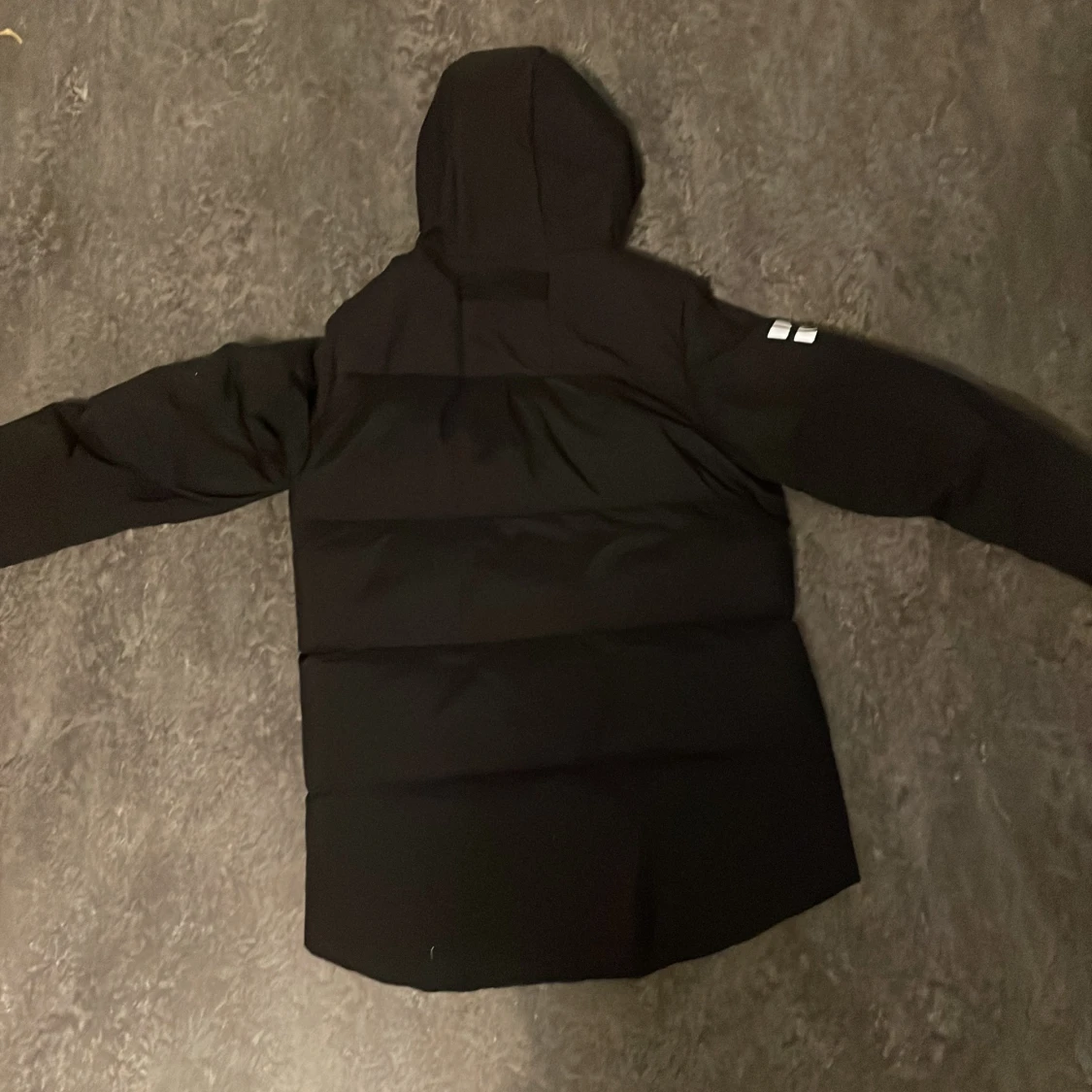 Svart dunjacka från Sail Racing - 90