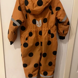 Orange vinter overall - Den är användes bara lite. Den blev liten så jag sålde den.