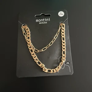 Halsband  - Oanvänt guldigt halsband.