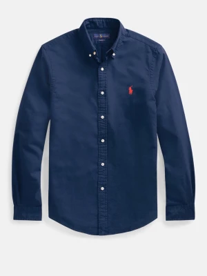 Mörkblå skjorta från Polo Ralph Lauren - Klassisk mörkblå skjorta från Polo Ralph Lauren med röd broderad logga på bröstet. Skjortan har långa ärmar, knappar framtill och button-down krage. Tillverkad i mjuk bomull för en bekväm känsla.