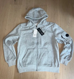 CP Company Hoodie - Gray CP Hoodie size XL but fits L more in my opinion. 