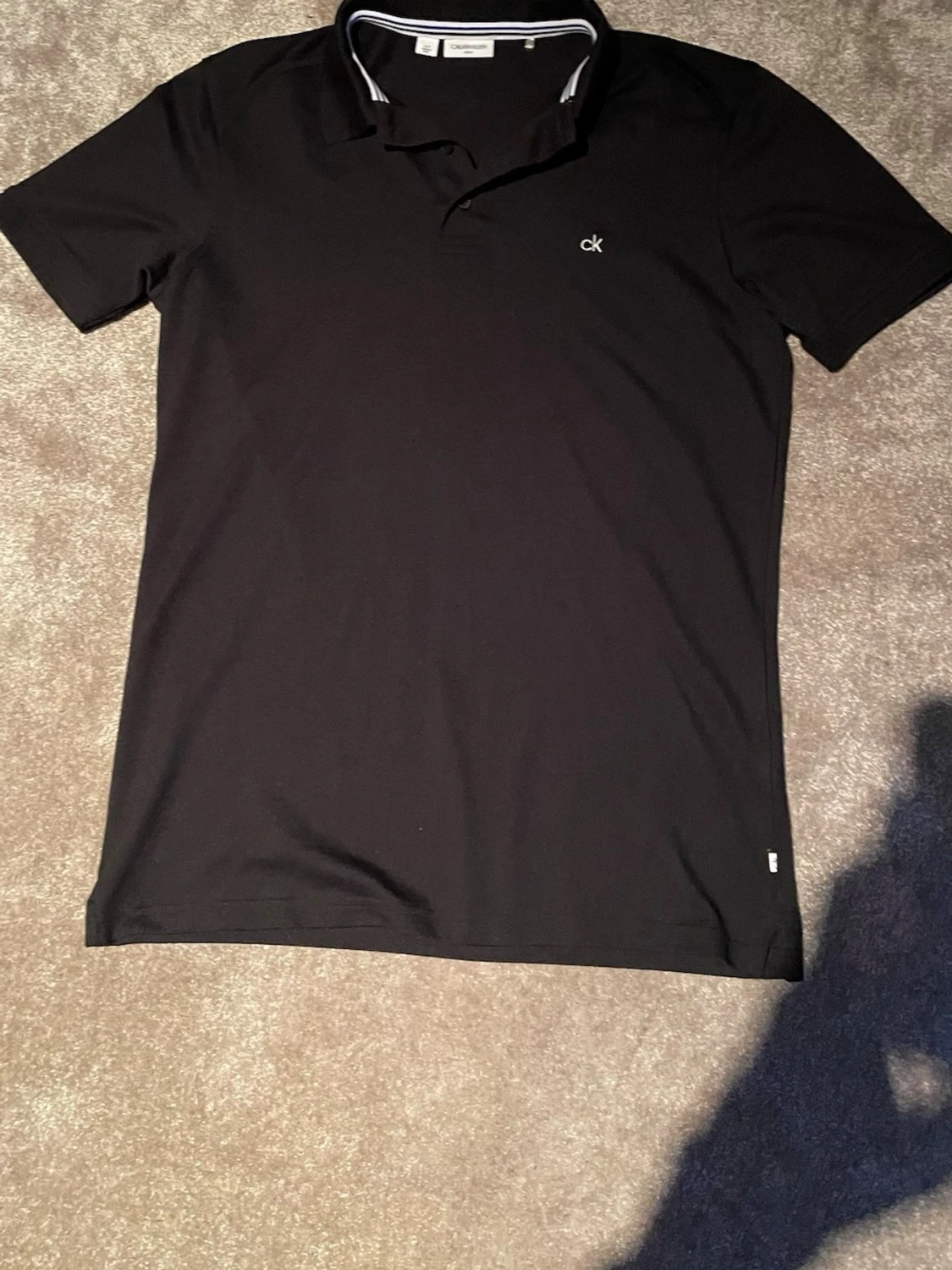 Svart pikétröja från Calvin Klein