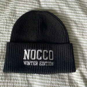 Nocco mössa - Oanvänd. 