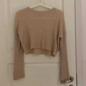 Rosa topp  - Rosa långärmad tröja.