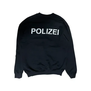 POLIZEI sweatshirt  - Trycket flagnar långsamt 