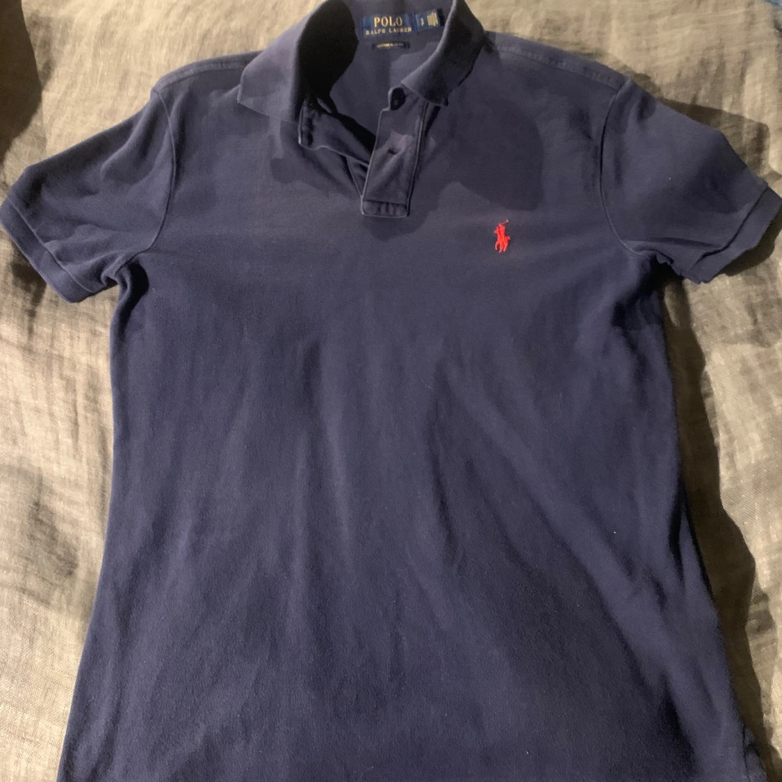 Mörkblå pikétröja från Ralph Lauren