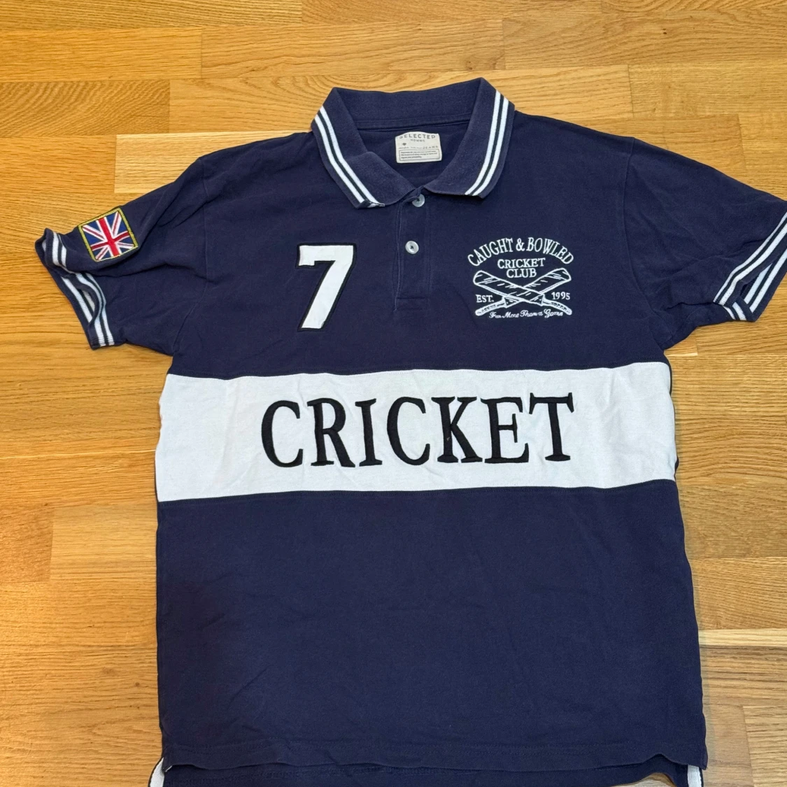 Mörkblå pikétröja från Selected Homme