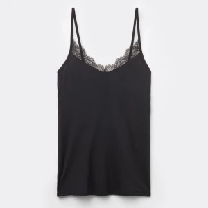 Intimissimi topp - Snyggt svart linne med spetsdetaljer som inte kommer till användning längre