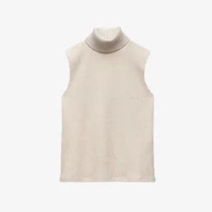 Topp - Säljer en stilren beige ärmlös polotröja från Zara. Perfekt för lager-på-lager eller som den är. Den har en ribbad polokrage som ger en snygg touch. Passar utmärkt till både jeans och kjol. 🧶✨