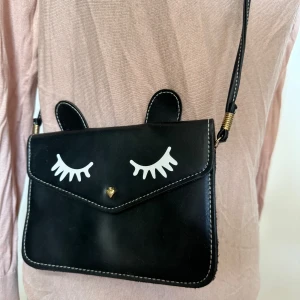 Cute bag with Ears - Cute black bag with ears and eyelashes