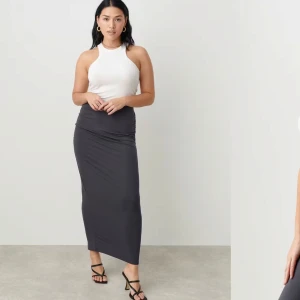 Soft touch ruched skirt - Gina Tricot - Mörkgrå kjol i färgen stone från Gina Tricot i deras Soft touch kollektion. Endast använd någon gång. Storlek M. Går att ha lågmidjat också för en längre modell😊