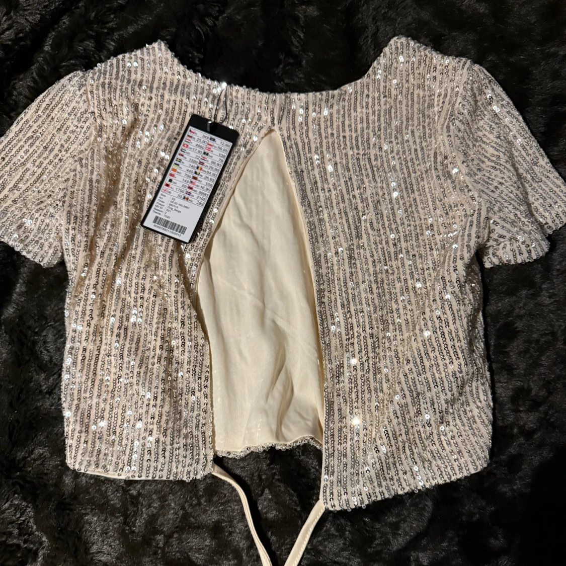 Glittrig kortärmad topp  - 1
