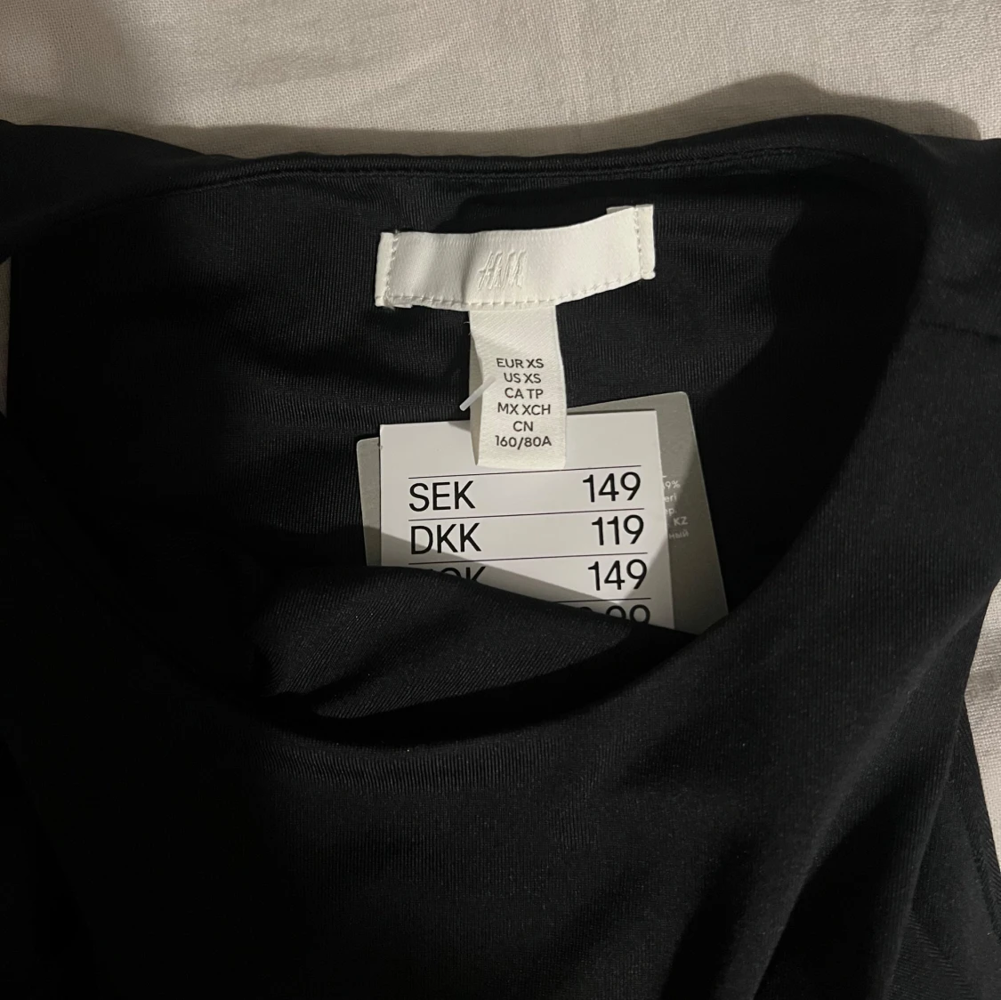 Svart ärmlös body från H&M - 91